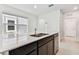 Modern kitchen with a large island, stainless steel appliances, and abundant natural light at 10426 Cross River Trl, Parrish, FL 34219