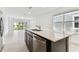 Open-concept kitchen with stainless steel appliances and views of the backyard at 10426 Cross River Trl, Parrish, FL 34219