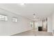 Bright and spacious living area with tile floors, recessed lighting, and an open layout at 10426 Cross River Trl, Parrish, FL 34219