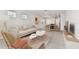 Bright, airy living room with tile flooring, modern furnishings, and access to the dining area at 10426 Cross River Trl, Parrish, FL 34219
