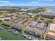 Stunning aerial view of waterfront condo community with boat slips and easy access to bay and gulf waters at 1109 Pinellas Bayway S # 306, Tierra Verde, FL 33715