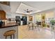Bright kitchen with tiled floors, white cabinetry, and black appliances, including breakfast nook and views to the lanai at 1109 Pinellas Bayway S # 306, Tierra Verde, FL 33715