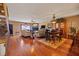 Spacious living room featuring gleaming wood floors, a cozy fireplace, and plush seating for relaxing and entertaining at 1109 Pinellas Bayway S # 306, Tierra Verde, FL 33715