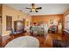 Spacious main bedroom featuring hardwood floors, a ceiling fan, and an ornate wrought iron bedframe at 1109 Pinellas Bayway S # 306, Tierra Verde, FL 33715