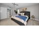 A well lit spacious bedroom with carpet, fan, and simple decor at 1115 Ashbourne Cir, Trinity, FL 34655