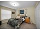 This bedroom features a bed, bedside tables, and a window with lots of natural light at 1115 Ashbourne Cir, Trinity, FL 34655