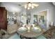 Cozy breakfast nook with wicker seating and views of the outdoor patio at 1115 Ashbourne Cir, Trinity, FL 34655
