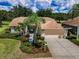 Charming single-story home featuring a two-car garage, meticulously landscaped yard and inviting curb appeal at 1115 Ashbourne Cir, Trinity, FL 34655