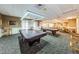 Bright game room with pool tables, seating, and ample space for leisure and recreation in a community setting at 1115 Ashbourne Cir, Trinity, FL 34655