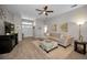 Inviting living room with neutral tones, decorative fireplace, and stylish coastal-inspired decor at 1115 Ashbourne Cir, Trinity, FL 34655