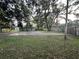 View of backyard and a shed with parking area at 12009 Washington St, Seffner, FL 33584
