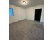 Bedroom featuring modern flooring and neutral walls at 12009 Washington St, Seffner, FL 33584