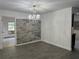 Elegant dining room area with wood-look floors and a decorative chandelier at 12009 Washington St, Seffner, FL 33584