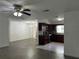 Spacious living room showcasing the seamless flow into the modern kitchen at 12009 Washington St, Seffner, FL 33584