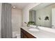 Well-lit bathroom featuring a sleek vanity, modern fixtures, and a shower-tub combination at 12824 Wanderlust Pl, Parrish, FL 34219