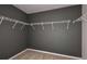 Walk-in closet with white wire shelving and neutral carpeting at 12824 Wanderlust Pl, Parrish, FL 34219