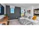 Bright living room featuring a comfortable white sofa, patterned pillows, and modern decor at 12824 Wanderlust Pl, Parrish, FL 34219