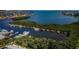 Breathtaking aerial view of the marina, lined with boats and surrounded by lush greenery along the waterfront at 1324 Pasadena S Ave # 501, South Pasadena, FL 33707