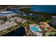 An elevated view of the community pool and marina, surrounded by landscaping and community buildings at 1324 Pasadena S Ave # 501, South Pasadena, FL 33707