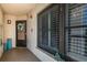 Entrance to a unit featuring a decorated door, potted plants and decorations at 1324 Pasadena S Ave # 501, South Pasadena, FL 33707