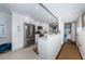 Bright kitchen featuring white cabinets, stainless steel appliances, and tile flooring at 1324 Pasadena S Ave # 501, South Pasadena, FL 33707