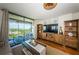 Bright living room with a balcony offering stunning water views and comfortable seating at 1324 Pasadena S Ave # 501, South Pasadena, FL 33707