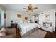 Cozy bedroom featuring a stylish ceiling fan, closet, and ample natural light at 1324 Pasadena S Ave # 501, South Pasadena, FL 33707
