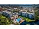 Aerial view of the Pasadena Cove pool, hot tub, and common area near the water at 1324 Pasadena S Ave # 501, South Pasadena, FL 33707