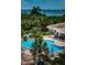 Enjoy the sparkling community pool surrounded by lush landscaping and swaying palms at 1324 Pasadena S Ave # 501, South Pasadena, FL 33707