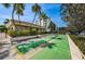 Shuffleboard courts next to the community building and nearby condos at 1324 Pasadena S Ave # 501, South Pasadena, FL 33707