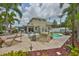 Inviting backyard with a pool, palm trees, hammock, and a cozy lounging area at 13728 Artesa Bell Dr, Riverview, FL 33579