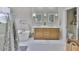 Well-lit bathroom with dual sinks, tub, and ample storage space at 13728 Artesa Bell Dr, Riverview, FL 33579