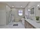 Modern bathroom with a walk-in shower and a standalone soaking tub at 13728 Artesa Bell Dr, Riverview, FL 33579