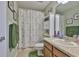 Bathroom with a shower and decorative shower curtain at 13728 Artesa Bell Dr, Riverview, FL 33579