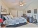 Well-lit bedroom featuring a ceiling fan and ample closet space at 13728 Artesa Bell Dr, Riverview, FL 33579