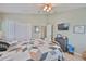 Bright bedroom with a ceiling fan, light walls and plush carpeting at 13728 Artesa Bell Dr, Riverview, FL 33579