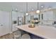 Bright eat-in kitchen with stainless steel appliances and quartz countertops at 13728 Artesa Bell Dr, Riverview, FL 33579