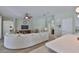 Spacious living room with wood-look flooring and comfortable neutral sectional seating at 13728 Artesa Bell Dr, Riverview, FL 33579