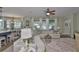 Cozy living room with open concept kitchen and large windows at 13728 Artesa Bell Dr, Riverview, FL 33579