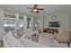 Bright living room featuring a comfortable sectional sofa and large windows at 13728 Artesa Bell Dr, Riverview, FL 33579