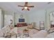 Inviting living room with a ceiling fan, TV, and a cozy reading nook at 13728 Artesa Bell Dr, Riverview, FL 33579