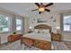 Comfortable main bedroom with large windows, ceiling fan and ample space at 13728 Artesa Bell Dr, Riverview, FL 33579