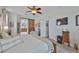 Beautiful main bedroom with barn door leading to a spa-like bathroom at 13728 Artesa Bell Dr, Riverview, FL 33579