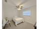 Simple bedroom with carpet, ceiling fan, and a window for natural light at 1548 Foxboro Dr, Palm Harbor, FL 34683