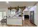 Modern kitchen with stainless steel appliances, granite countertops, and wooden beam accents at 1548 Foxboro Dr, Palm Harbor, FL 34683