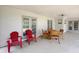 Spacious covered patio with outdoor seating, offering a relaxing area for entertaining at 1548 Foxboro Dr, Palm Harbor, FL 34683