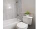 Updated bathroom with tub/shower combination, neutral tiling, and modern amenities at 15623 Morgan St, Clearwater, FL 33760