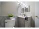 Modern bathroom with sleek vanity, stylish tiling, and updated fixtures at 15623 Morgan St, Clearwater, FL 33760