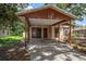 Covered carport with a basketball hoop, adjacent to the main house at 15623 Morgan St, Clearwater, FL 33760