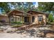 Charming single-story home featuring a carport, tidy landscaping, and classic curb appeal at 15623 Morgan St, Clearwater, FL 33760